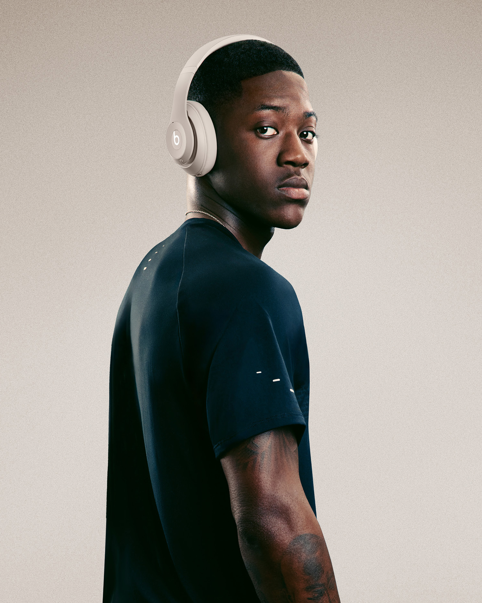 A Beats image of a footballer wearing headphones